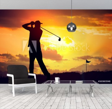 Picture of Silhouette of man playing golf at sunset